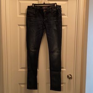 Buckle skinny jeans